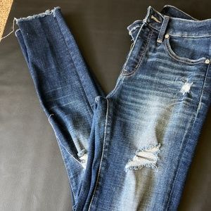 Buckle black skinny jeans distressed